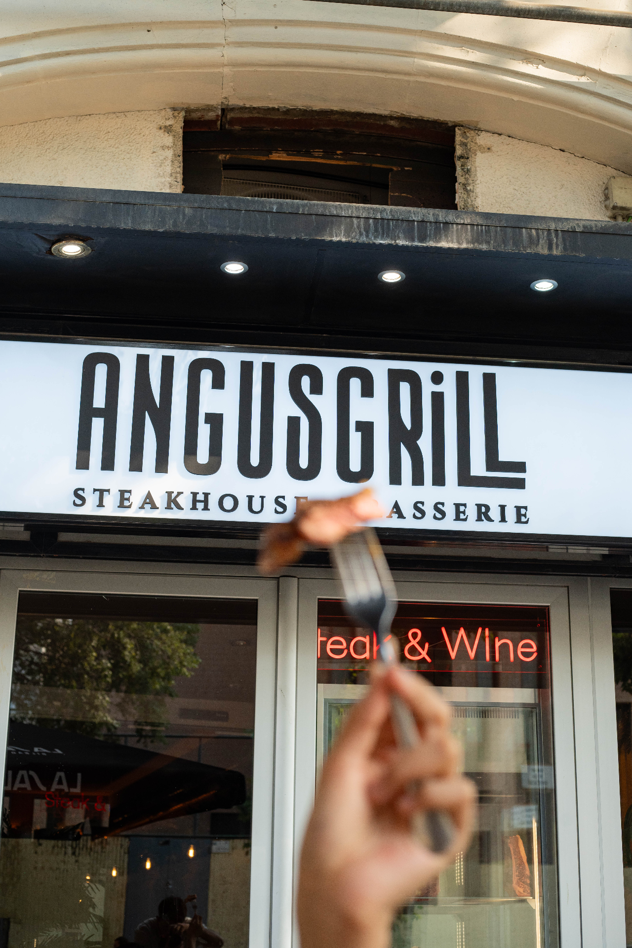 Angus Grill sign with steak on fork