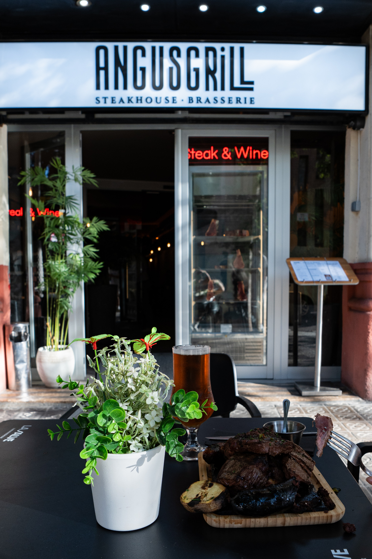 Angus Grill storefront on Carrer de la Diputació, Barcelona